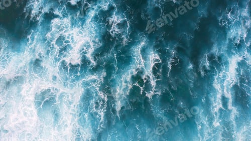 Preview: Blue foaming waves in North Beach in Nazare, Portugal