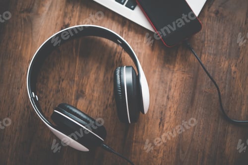 Preview: headphones are on the desk with a laptop. Music ideas for relaxation