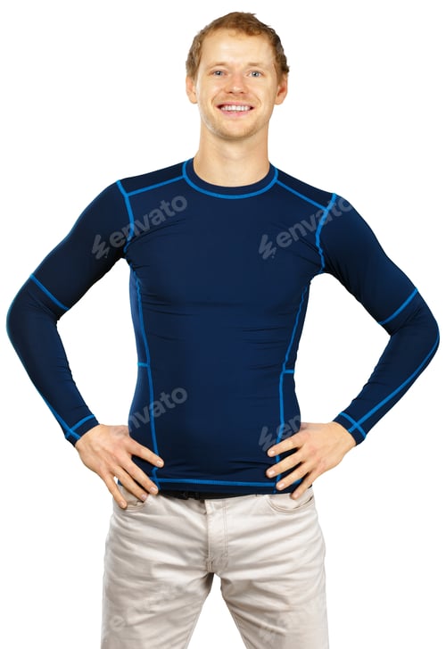 Preview: Man poses with hands on hips while wearing a blue long-sleeve shirt and light pants indoors