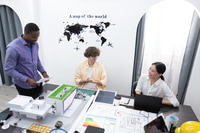 Preview: Teamwork architects designers brainstorm modern office an using laptop with blueprint on table.