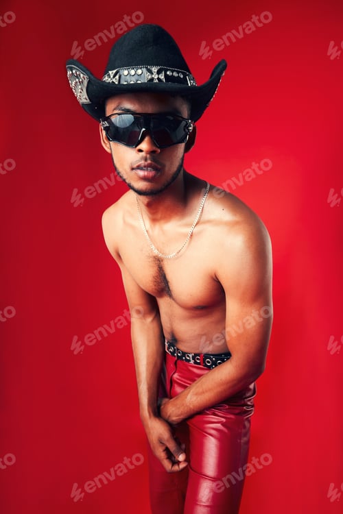 Preview: Fashion, man and cowboy hat, sunglasses and shirtless, clothes and gen z isolated on red background
