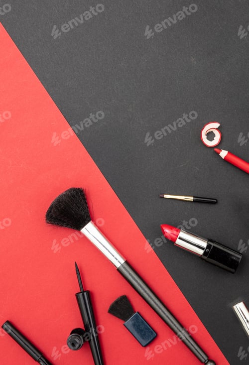 Preview: Make-up cosmetics accessories against red and black background