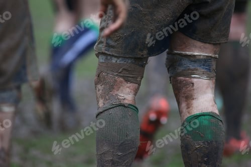 Preview: Closeup of dirty rugby players in the field