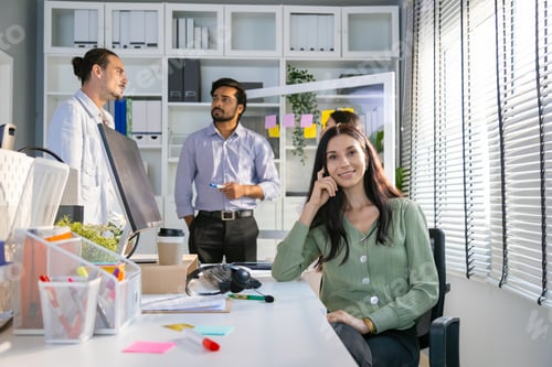 Preview: Group of multiethnic young business friends gathered in a modern office conference room