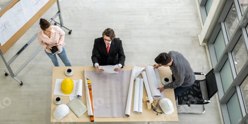 Preview: Engineer team meeting to inspect the construction blueprint drawings and work plan