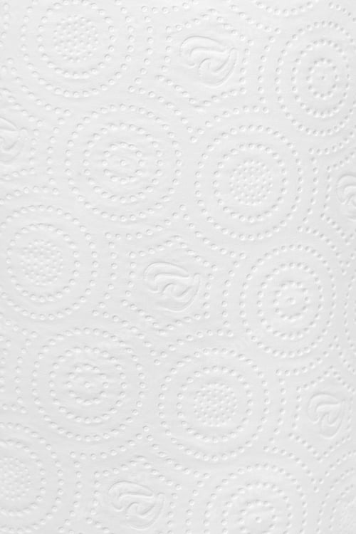 Preview: Close-up of a roll of white paper with a distinctive non-standard texture.