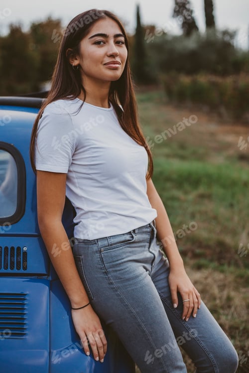 Preview: Portrait of woman leaning against car in countryside, Florence, Toscana, Italy