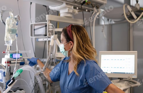 Preview: Doctor managing ventilator settings in intensive care unit