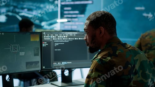 Preview: Soldier working with AI intelligence on pc in control room