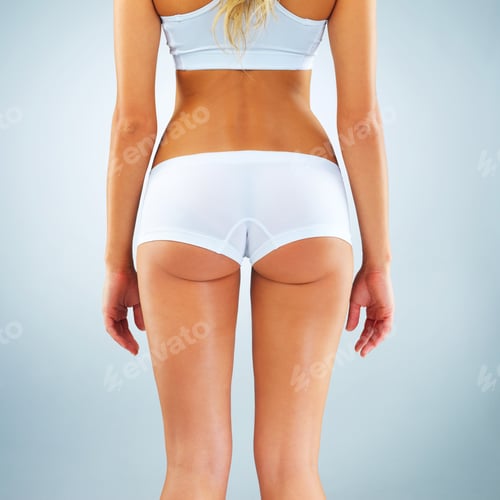 Preview: Studio shot of an unrecognizable woman posing against a blue background