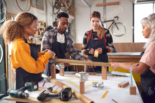 Preview: Multi-Cultural Team In Workshop Assembling Hand Built Sustainable Bamboo Bicycle Frame