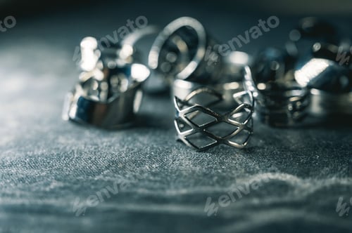 Preview: Closeup shot of a pile of vintage silver decorative rings