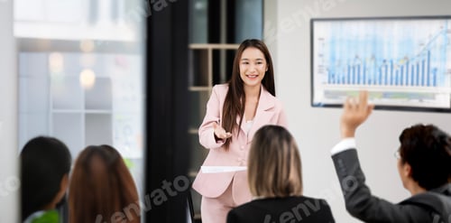 Preview: Group of asian colleagues engaging in a discussion during a business meeting in a conference room.