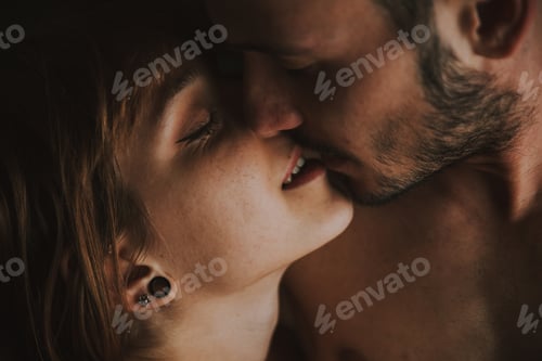 Preview: young couple relaxing in bed and having fun.