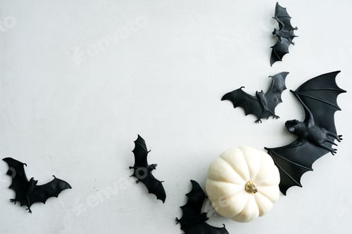 Preview: Happy Halloween flat lay background with pumpkins and bats.