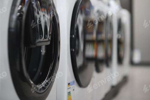 Preview: Rows of modern washing machines in a store