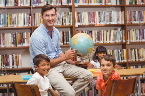Preview: Cute Pupils And Teacher Looking At Globe In Library At The Elementary School