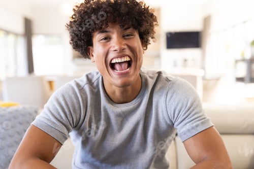 Preview: On video call, Laughing joyfully, young man at home