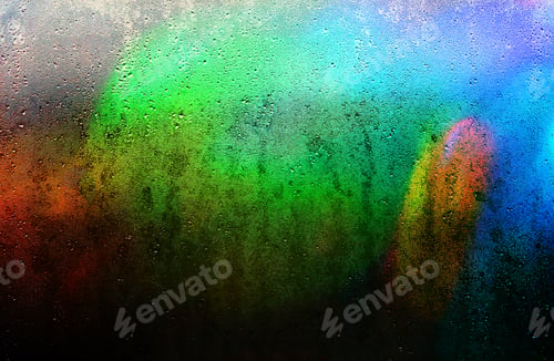 Preview: Abstract background of a rain-wet glass with striking colors and copy space.