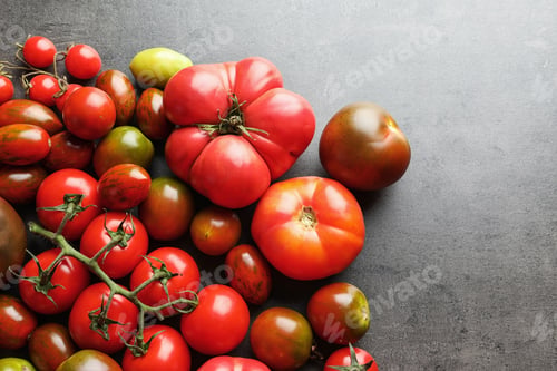 Preview: Flat lay composition with juicy tomatoes on grey background