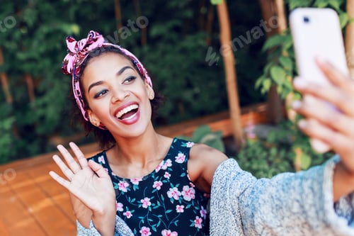 Preview: Playful happy black womAn with perfect teeth making self portrait