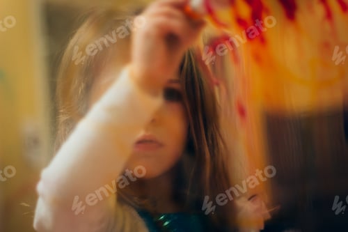Preview: young girl painting on glass
