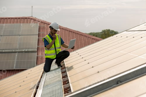Preview: Engineer working setup Solar panel at the roof top.