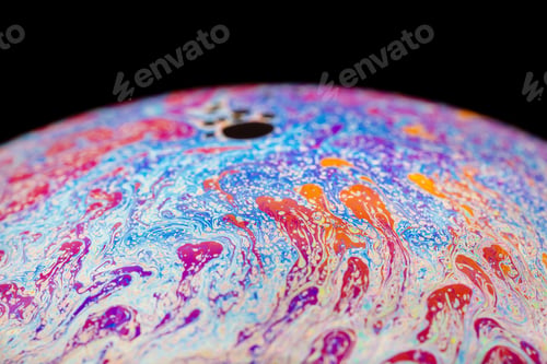 Preview: Multicolored abstract chaotic pattern inside of the soap bubble, closeup