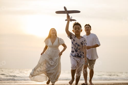 Preview: Asian family activity beach weekend together. Family lifestyles. Togetherness people.