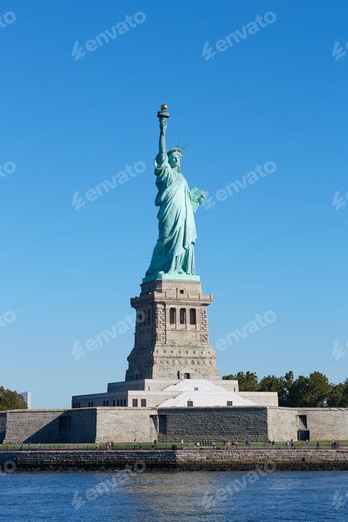 Preview: Statue of Liberty and Liberty Island in a sunny day, blue sky