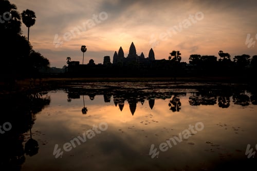 Preview: Dawn breaks over an ancient temple with its silhouette reflecting in the water.