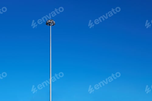 Preview: Light poles, copy space. LED light post for parking lot, blue sky background.