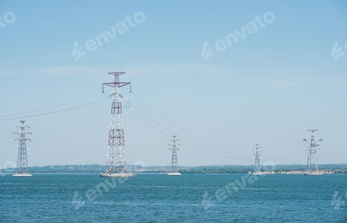 Preview: High-voltage pylons of power lines on the river