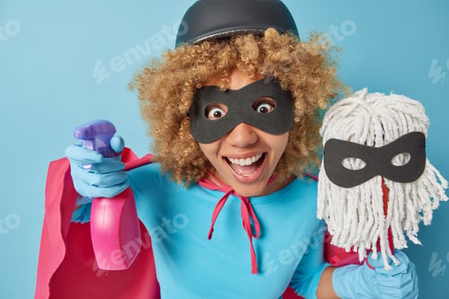Preview: Horizontal shot of surprised curly haired female housewife hold bottle of cleaning detergent and mop