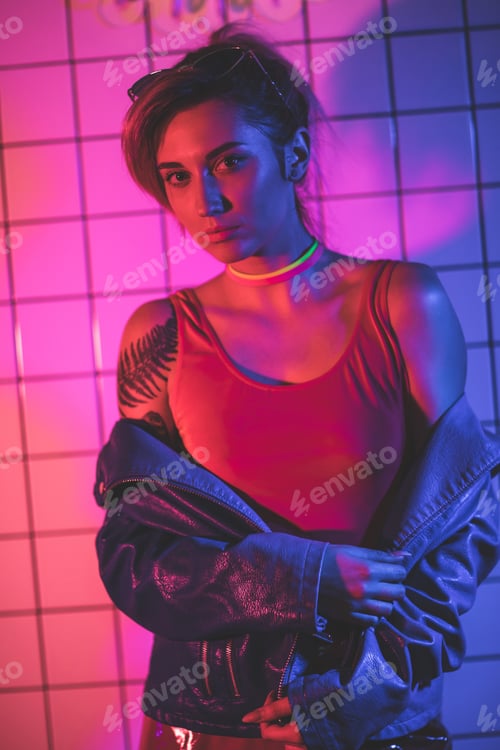 Preview: toned image with stylish girl posing in black leather jacket