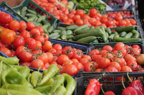 Preview: Fresh produce display at local market in summer afternoon sun