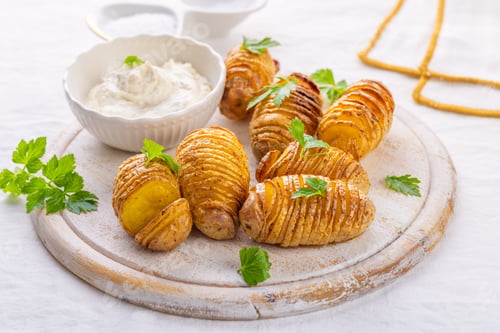 Preview: Traditional Swedish dish Hasselback potatoes with cream cheese dip