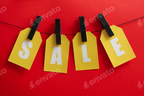 Preview: Text Sale hanging on the clothesline on red background