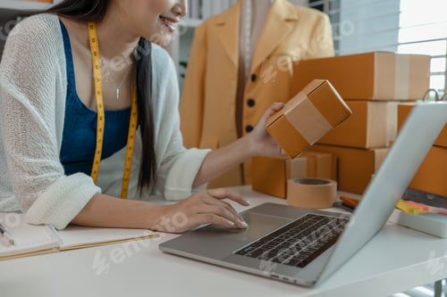 Preview: a designer is preparing products to send to customers by mail