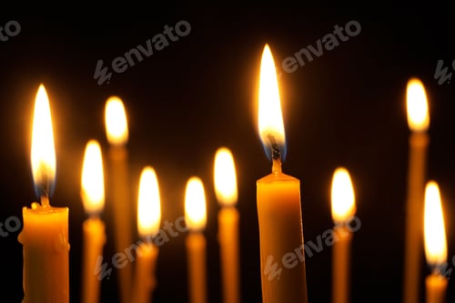 Preview: Burning candles on dark background. Symbol of sorrow