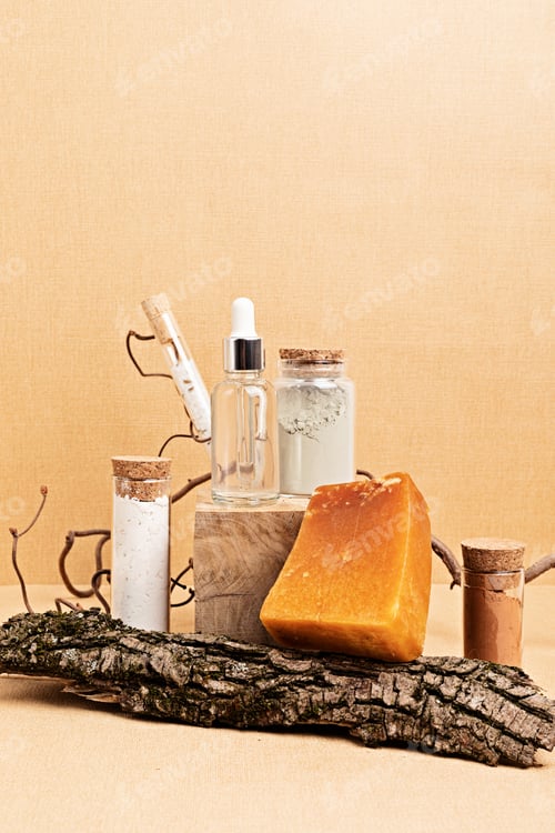 Preview: Natural serum, soap and clay masks displayed with pieces of wood on sand beige background