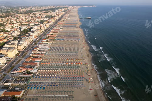 Preview: Aerial view of the equipped beach in Lido di Camaiore Versilia with aligned umbrellas