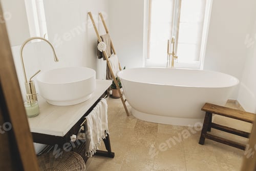Preview: Stylish boho bathroom design. Modern bathtub with golden faucet from floor