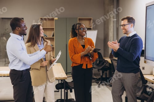 Preview: Professional team brainstorming, sharing insights and celebrating achievements