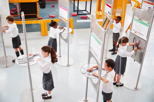 Preview: School kids doing science tests at a science centre