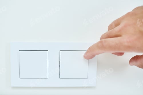 Preview: Hand is turning on or off on light switch, closeup