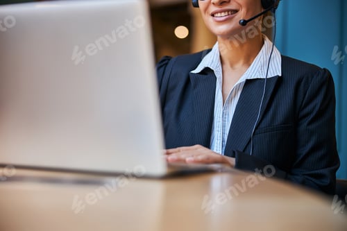 Preview: Close up of pleased woman working online