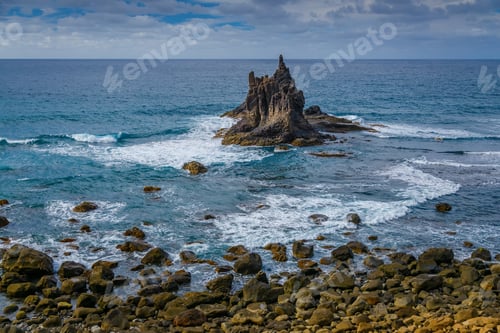 Preview: Coastal scene at Playa Benijo in Tenerife with prominent rock formation rising from the sea