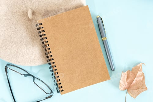 Preview: Top view of a pen and notepad on the office table