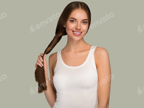 Preview: Beautiful woman with long smooth healthy hair tail beauty casual style. Color background green